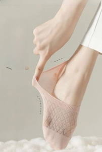 Detail of pink mesh invisible socks showing high elasticity and breathable thin texture