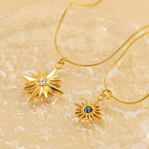 Gold plated titanium steel tarot starburst necklaces with blue and clear zircon pendants