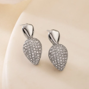 Elegant silver-toned pear-shaped dangle earrings with micro-paved sparkling cubic zirconia