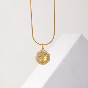 Golden titanium steel necklace with star and moon coin pendant and pave crystals