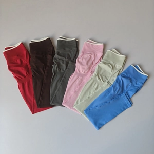 Selection of seamless high-waisted yoga leggings in various colors with ribbed waistband