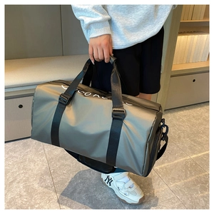 Waterproof nylon sports duffel bag with durable black straps and stylish printed logo