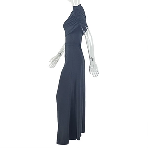Close-up of ruched short sleeves and pleated fabric details on a slim fit grey dress
