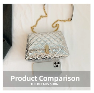 Detailed top view of silver quilted crossbody bag with gold chain and metal clasp
