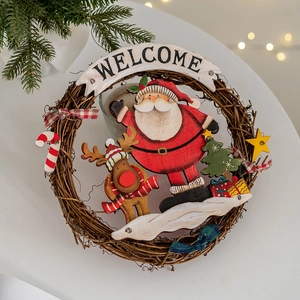 Christmas welcome wreath with Santa and Reindeer on a wooden hanging door sign