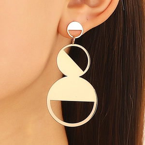 Exaggerated gold geometric drop earrings with hollow rings and minimalist retro design
