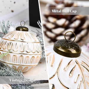 Detail of white 8cm Christmas ball with gold vintage patterns and metal ball cap
