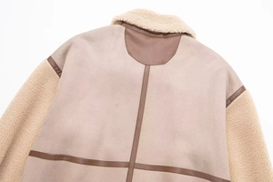 Detail of faux suede shearling jacket back with cream lamb wool and dark brown trim