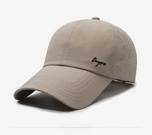 Detail of laser-cut ventilation holes and Caypro embroidery on beige baseball cap