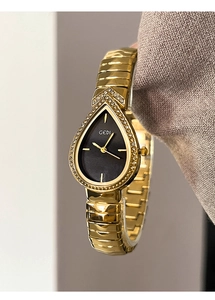Close-up of GEDI watch with teardrop dial, gold case and sparkling rhinestone bezel
