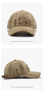 Close-up of distressed khaki baseball cap featuring letter B patch and frayed hole details