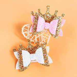 Sparkly crown and bow hair clips for girls featuring gold glitter and pink sequins fabric