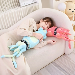 Long cartoon squid plush pillow in blue and pink colors used as a cozy sleeping bolster