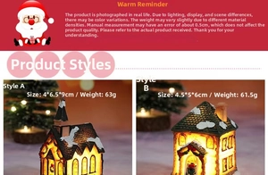 Detail view of two glowing resin Christmas miniature houses with warm LED lights and snow
