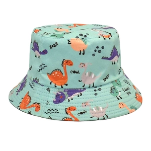Detail of light green cotton kids bucket hat featuring colorful cartoon dinosaur prints
