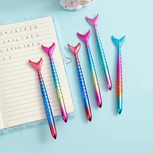 Detail view of 5 mermaid tail gel pens with vibrant gradient colors and metallic fish scales