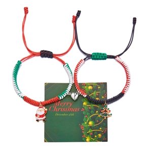 Christmas magnetic heart bracelets with woven cords and Santa charms on a gift card