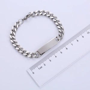 Macro view of 8mm stainless steel curb chain bracelet with blank engravable ID plate