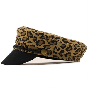 Detail of leopard print baker boy hat with black braided rope and gold button decor