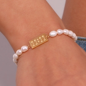 Elegant freshwater pearl bracelet with a golden 11:11 rectangular metal charm for women