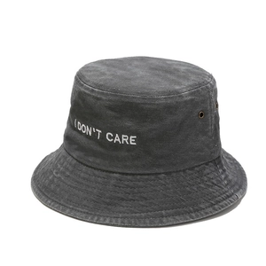 Washed charcoal grey bucket hat with white embroidered I Don't Care slogan