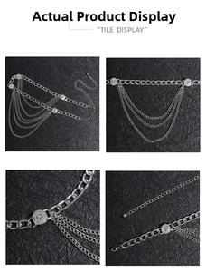 Detail view of multi-layer silver metal waist chain with embossed round coins and lobster clasp