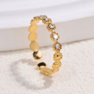 Close-up of gold-plated stainless steel ring with zircon stones and adjustable band
