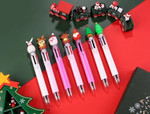 Detail of Christmas multi-color ballpoint pens with Santa and reindeer silicone toppers