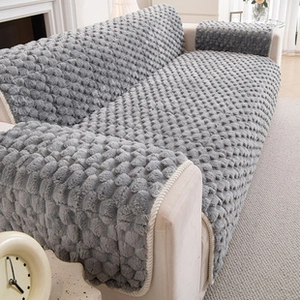 Close-up of gray flannel chair cushion with thick bubble texture for soft sofa seating