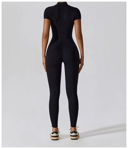 Detail view of the back seams and high-elastic fabric on a black short sleeve yoga jumpsuit