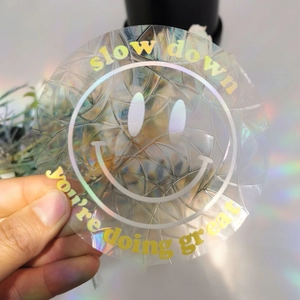 Close-up of holographic suncatcher window sticker with slow down and you're doing great text