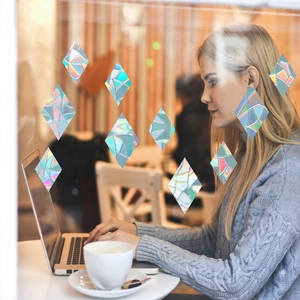 Rainbow prism static window film with holographic diamond pattern on a glass window