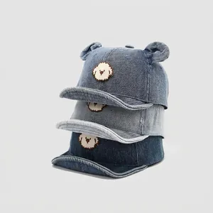 Kids denim baseball cap with bear embroidery and 3D ears in dark and light blue denim