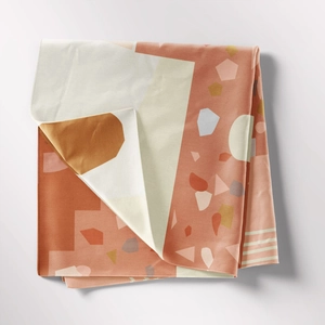 Detail view of Bohemian terrazzo tapestry showing thick cotton fabric and geometric patterns