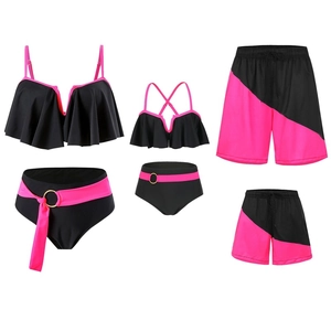 Family matching swimwear set in vibrant pink and black featuring ruffled bikinis and beach shorts