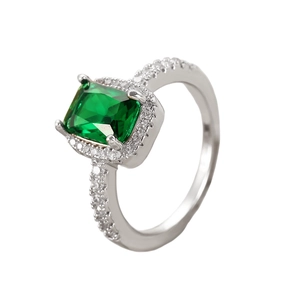 Detail of silver ring with green square zircon and sparkling micro-pave stones