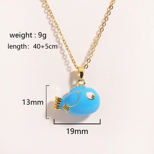 Golden necklace with a cute blue ceramic fish pendant and size details on white background