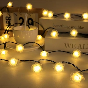 Solar powered LED rose flower string lights for outdoor garden and home bedroom decor