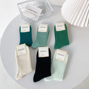 Combed cotton ribbed socks in green and neutral tones set of six displayed on a white tray