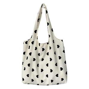 Minimalist canvas tote bag with black heart pattern and large capacity for women
