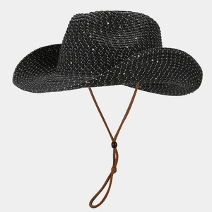 Detail of black straw cowboy hat with gold sequins and brown adjustable chin strap