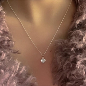 Minimalist 925 sterling silver heart pendant necklace with zircon on a purple coat