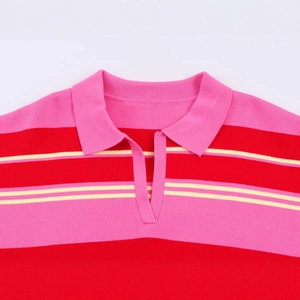 Pink and red striped knit polo shirt with a classic V-neck collar shown in flat lay