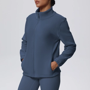 Detail of navy blue fleece jacket showing stand collar and full-zip texture for sports
