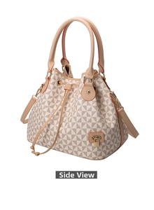 Detail view of the geometric bucket bag showing side structure and orange edge paint