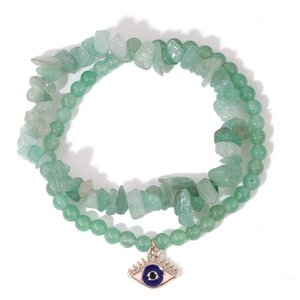 Detailed macro view of the double-layer green stone beads bracelet with evil eye pendant