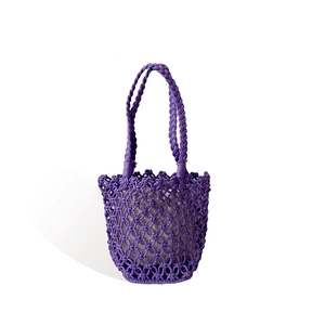 Handwoven purple bucket bag with hollow diamond mesh pattern for summer beach vacations