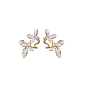 Elegant gold metal double butterfly earrings with mother of pearl inlay on white background
