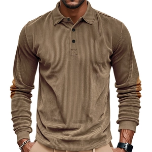 Close-up of brown corduroy polo shirt featuring textured fabric and elbow patch details