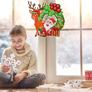 DIY 5D Christmas diamond painting wreath with Santa and reindeer on a cozy window